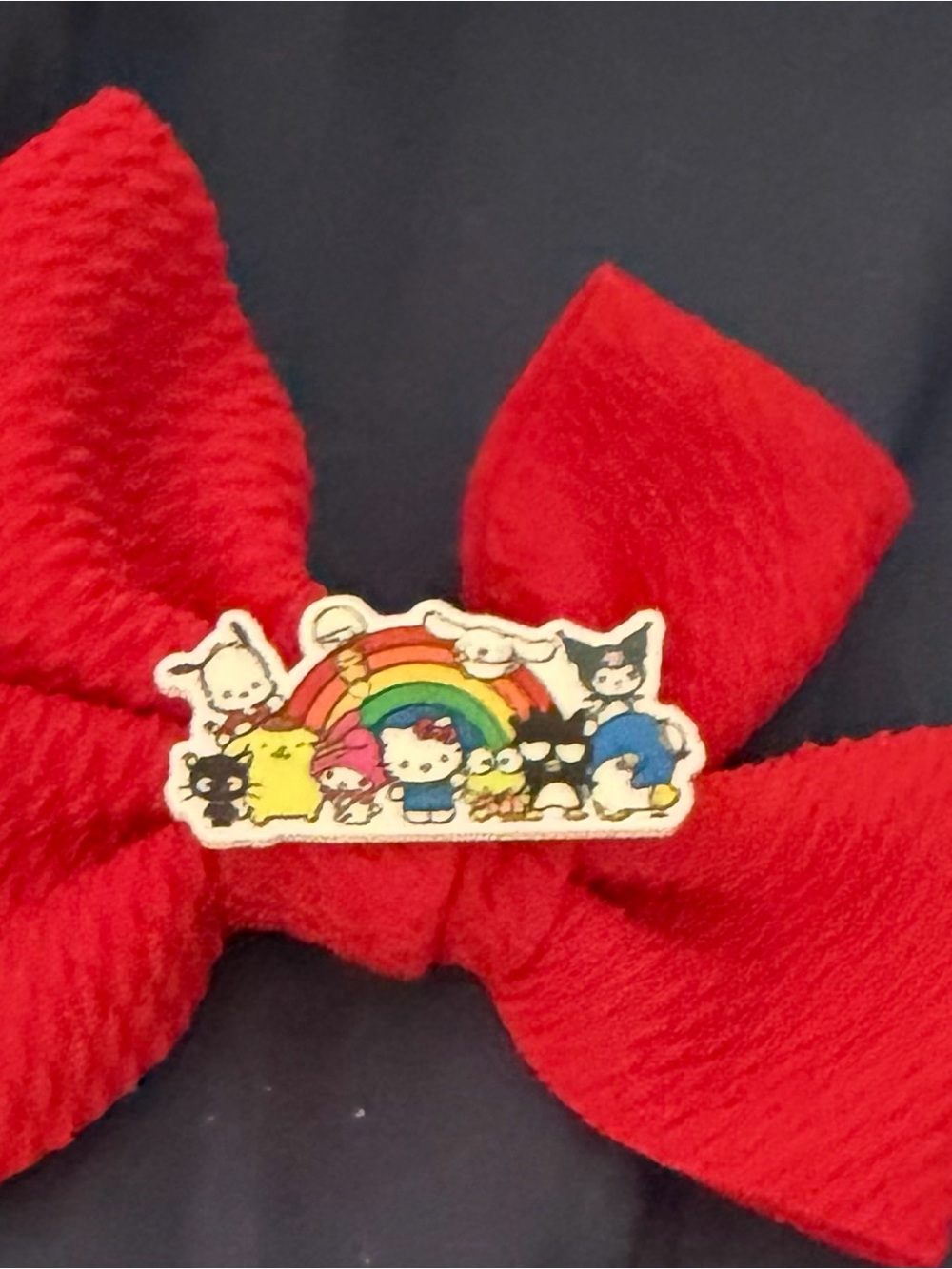 Red Fabric Bow Pin with Rainbow Character Charm